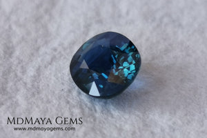 Untreated dark greenish blue sapphire 1.75 ct. Oval cut.  Amazing dark greenish blue sapphire with a good behavior under any type of light. It has a good size, and it will look perfect on your personalized jewelry, either in a ring or a pendant. It has some inclusions that although they are visible from some angles, they do not affect its beautiful at all. This amazing sapphire is ideal for those who look for precious stones without treatment of any kind.