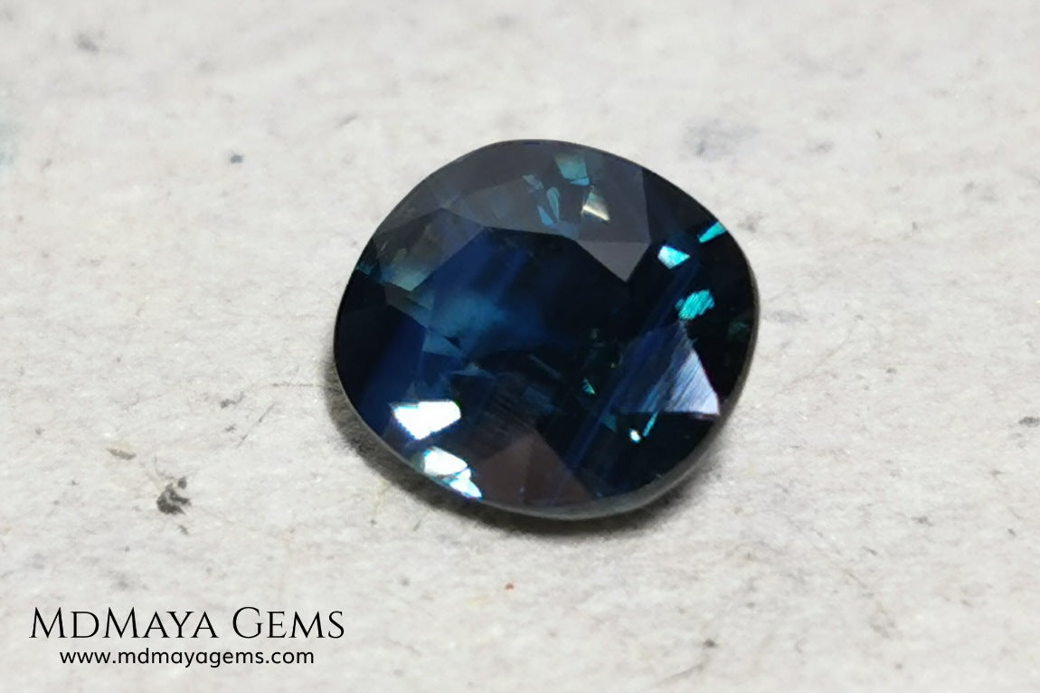 Untreated dark greenish blue sapphire 1.75 ct. Oval cut.  Amazing dark greenish blue sapphire with a good behavior under any type of light. It has a good size, and it will look perfect on your personalized jewelry, either in a ring or a pendant. It has some inclusions that although they are visible from some angles, they do not affect its beautiful at all. This amazing sapphire is ideal for those who look for precious stones without treatment of any kind.