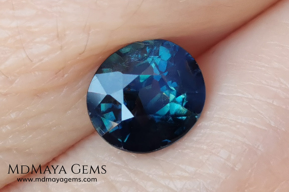 Untreated Greenish Blue Sapphire 1.79 ct, oval cut with certificate.  This greenish-blue sapphire has a very good behavior under any type of light, whether under incandescent or natural light. It has a cloudy zone, which can be seen in the photos, although it is really very beautiful gemstone, it has a very good size for a ring or any piece of jewelry. A great untreated blue sapphire at an affordable price. 