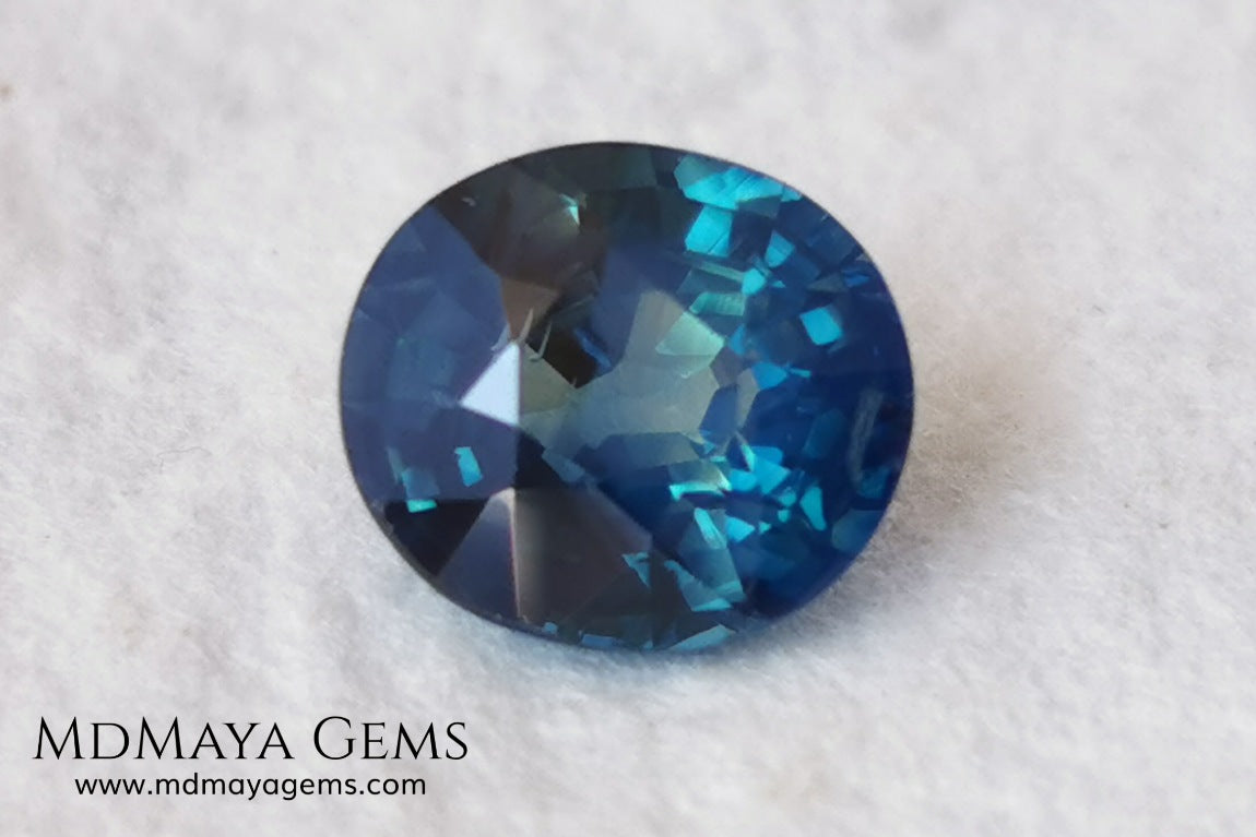 Untreated Greenish Blue Sapphire 1.79 ct, oval cut with certificate.  This greenish-blue sapphire has a very good behavior under any type of light, whether under incandescent or natural light. It has a cloudy zone, which can be seen in the photos, although it is really very beautiful gemstone, it has a very good size for a ring or any piece of jewelry. A great untreated blue sapphire at an affordable price. 