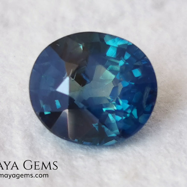 Untreated Greenish Blue Sapphire 1.79 ct, oval cut with certificate.  This greenish-blue sapphire has a very good behavior under any type of light, whether under incandescent or natural light. It has a cloudy zone, which can be seen in the photos, although it is really very beautiful gemstone, it has a very good size for a ring or any piece of jewelry. A great untreated blue sapphire at an affordable price. 