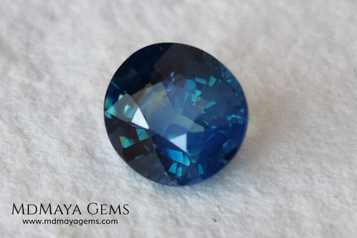 Untreated Greenish Blue Sapphire 1.79 ct, oval cut with certificate.  This greenish-blue sapphire has a very good behavior under any type of light, whether under incandescent or natural light. It has a cloudy zone, which can be seen in the photos, although it is really very beautiful gemstone, it has a very good size for a ring or any piece of jewelry. A great untreated blue sapphire at an affordable price. 