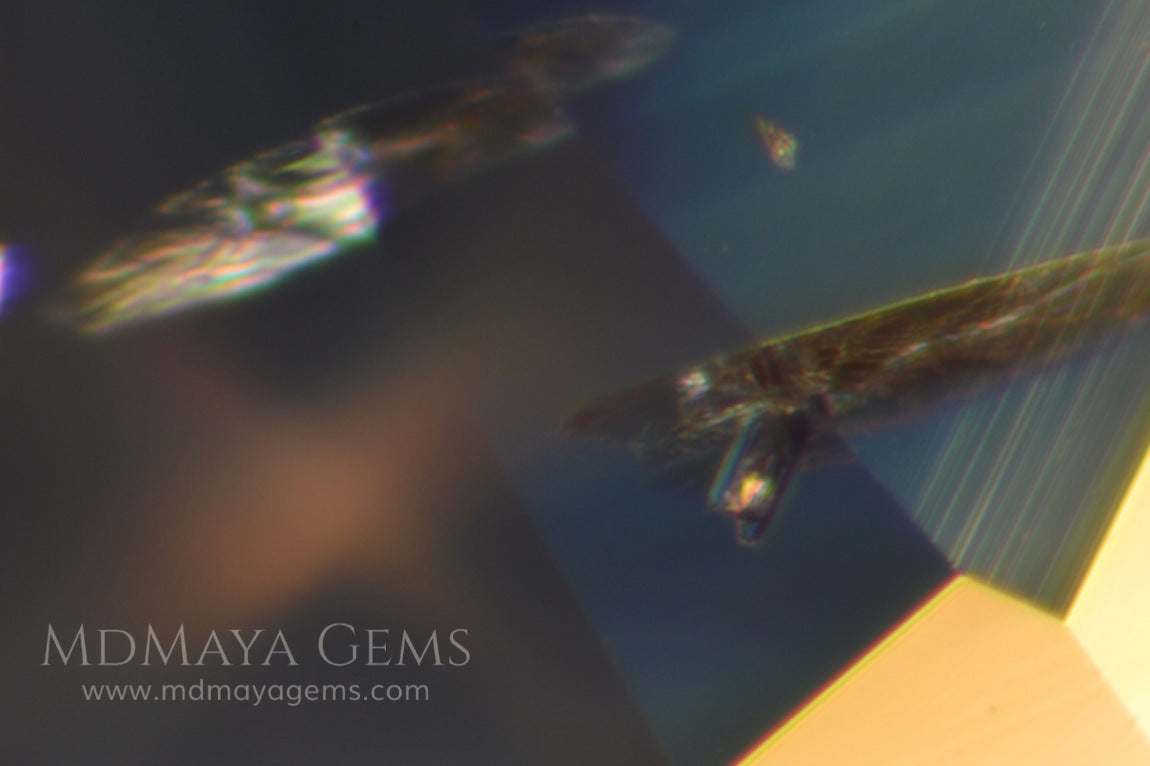 inclusions in greenish blue sapphire 1.79 ct