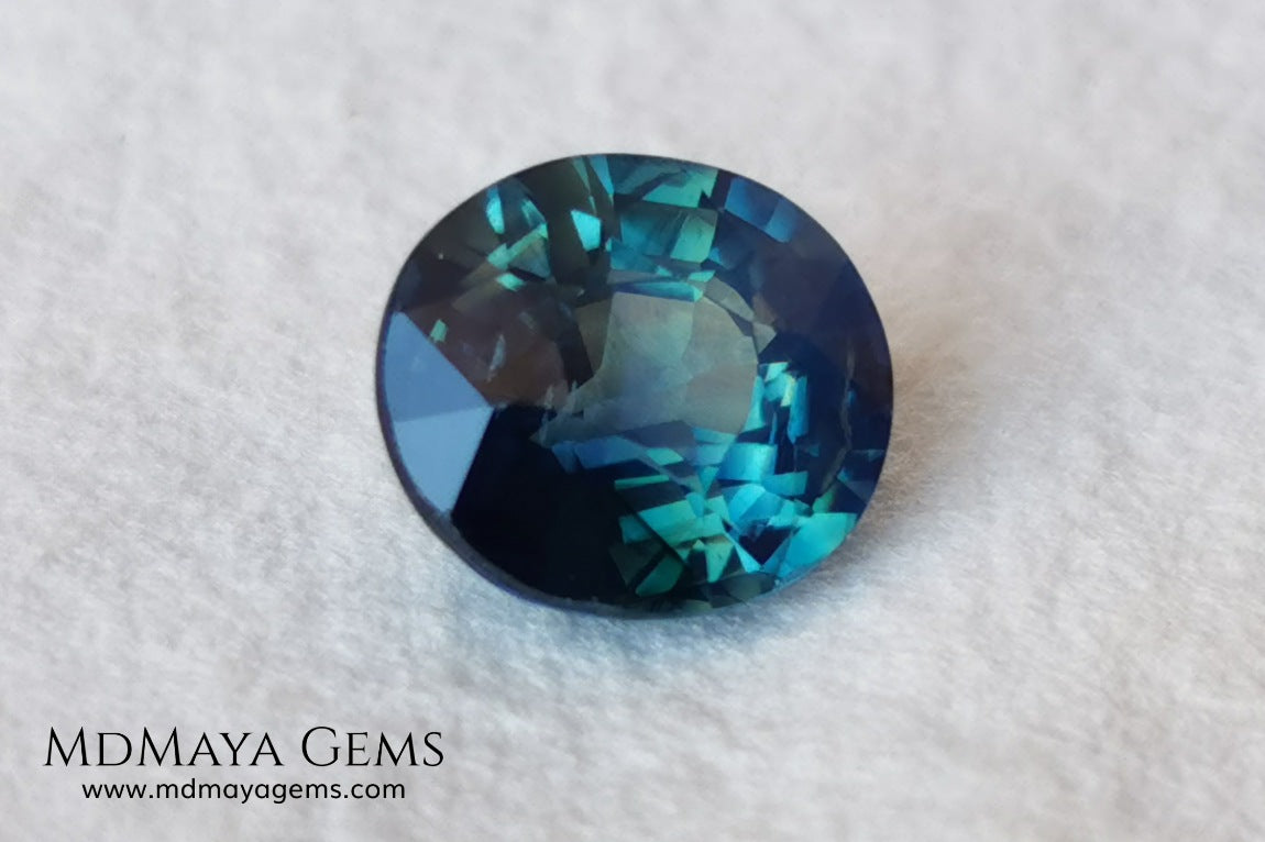 Untreated Greenish Blue Sapphire 1.79 ct, oval cut with certificate.  This greenish-blue sapphire has a very good behavior under any type of light, whether under incandescent or natural light. It has a cloudy zone, which can be seen in the photos, although it is really very beautiful gemstone, it has a very good size for a ring or any piece of jewelry. A great untreated blue sapphire at an affordable price. 