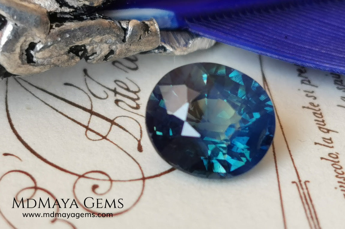 Untreated Greenish Blue Sapphire 1.79 ct, oval cut with certificate.  This greenish-blue sapphire has a very good behavior under any type of light, whether under incandescent or natural light. It has a cloudy zone, which can be seen in the photos, although it is really very beautiful gemstone, it has a very good size for a ring or any piece of jewelry. A great untreated blue sapphire at an affordable price. 