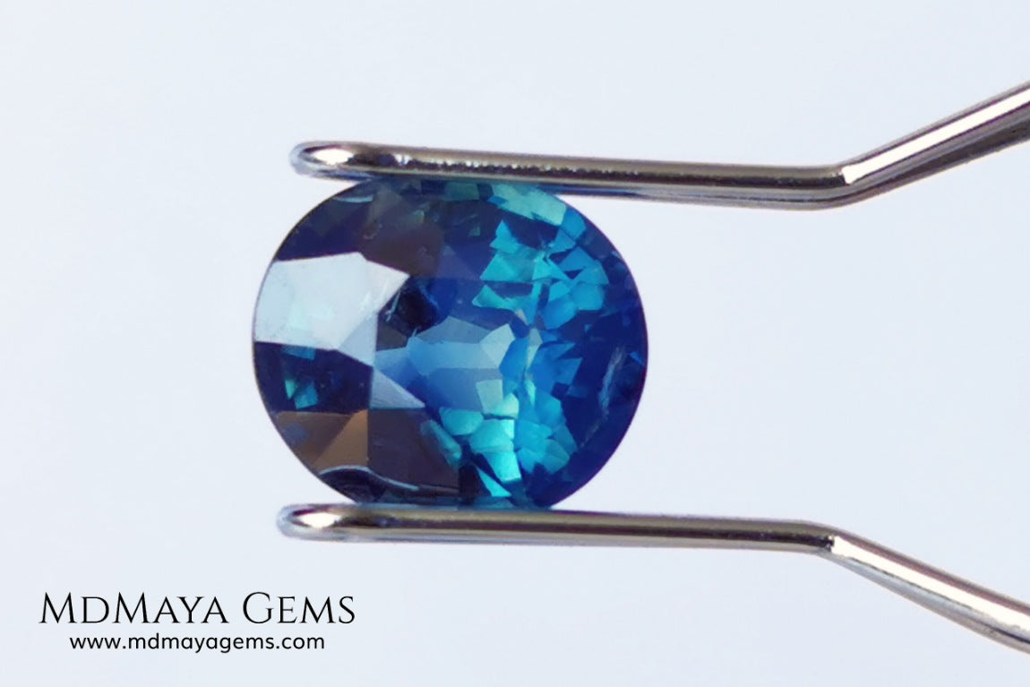 Untreated Greenish Blue Sapphire 1.79 ct, oval cut with certificate.  This greenish-blue sapphire has a very good behavior under any type of light, whether under incandescent or natural light. It has a cloudy zone, which can be seen in the photos, although it is really very beautiful gemstone, it has a very good size for a ring or any piece of jewelry. A great untreated blue sapphire at an affordable price. 