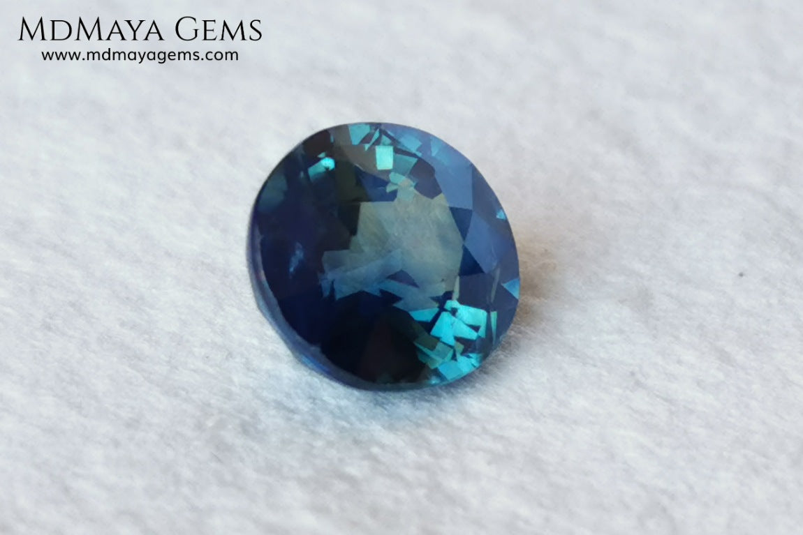 Untreated Greenish Blue Sapphire 1.79 ct, oval cut with certificate.  This greenish-blue sapphire has a very good behavior under any type of light, whether under incandescent or natural light. It has a cloudy zone, which can be seen in the photos, although it is really very beautiful gemstone, it has a very good size for a ring or any piece of jewelry. A great untreated blue sapphire at an affordable price. 