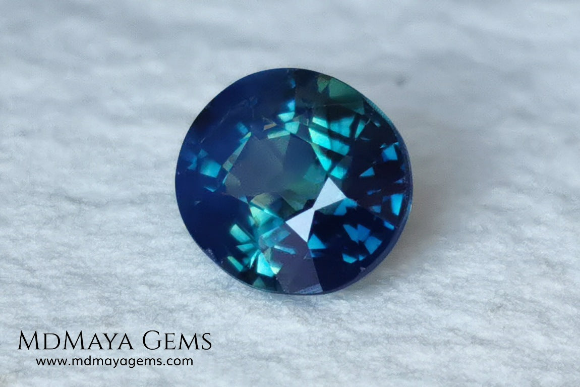 Untreated Greenish Blue Sapphire 1.79 ct, oval cut with certificate.  This greenish-blue sapphire has a very good behavior under any type of light, whether under incandescent or natural light. It has a cloudy zone, which can be seen in the photos, although it is really very beautiful gemstone, it has a very good size for a ring or any piece of jewelry. A great untreated blue sapphire at an affordable price. 