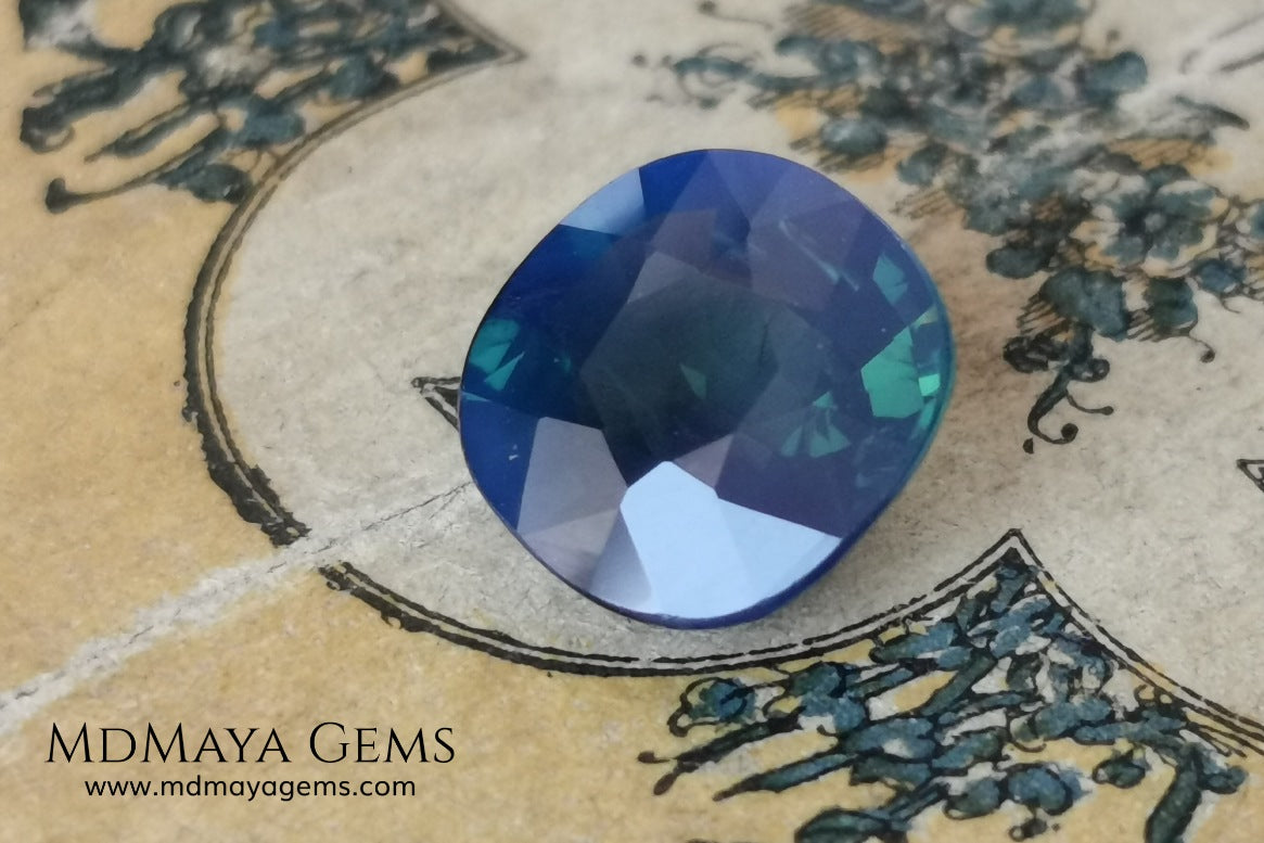 Untreated greenish blue Sapphire 3.61 ct. Cushion cut.  natural untreated blue sapphire has a large green component inside, under natural light you can see a dull and translucent blue sapphire, although under incandescent light everything changes, this sapphire shines from all sides and a bright green color is seen throughout the interior. It is a gem only for the very daring, with an extra: its price (certificate included).