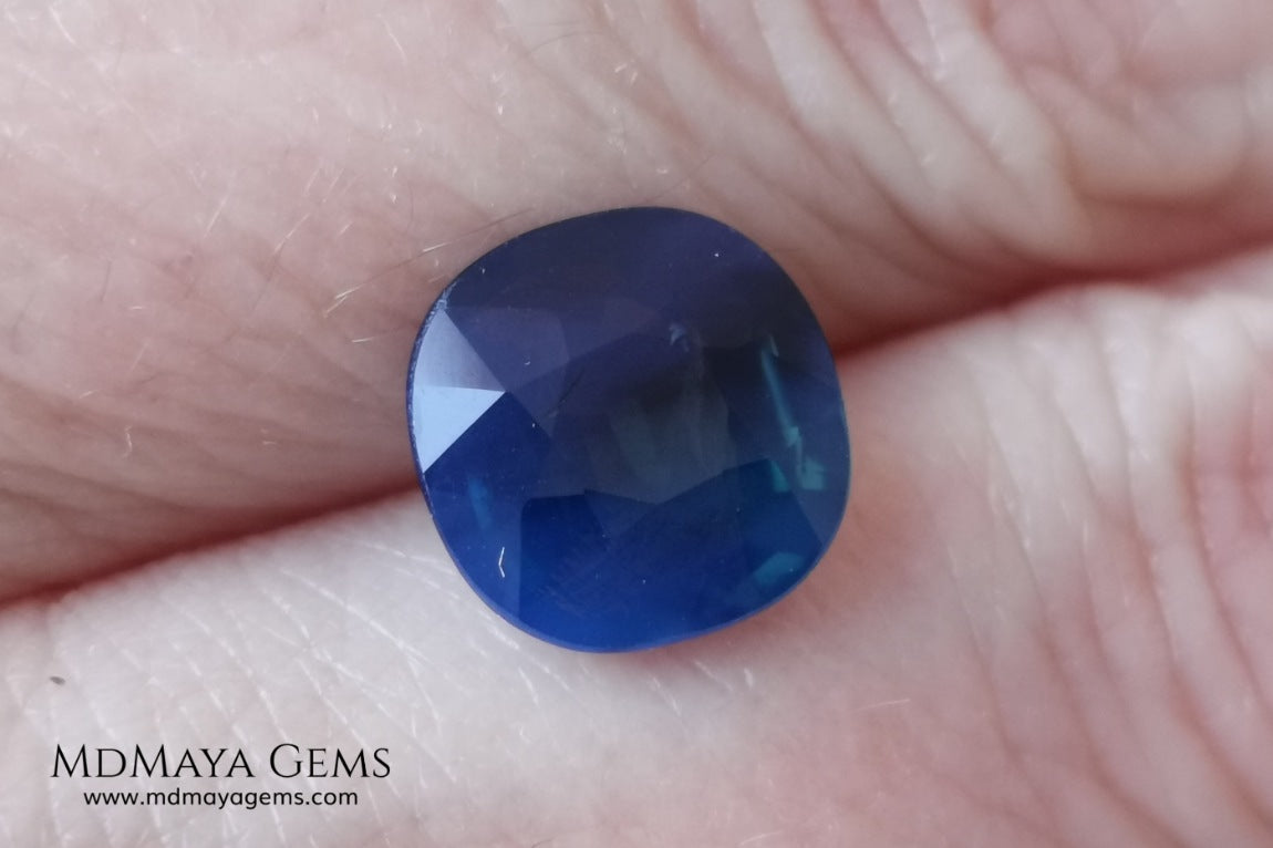 Untreated greenish blue Sapphire 3.61 ct. Cushion cut.  natural untreated blue sapphire has a large green component inside, under natural light you can see a dull and translucent blue sapphire, although under incandescent light everything changes, this sapphire shines from all sides and a bright green color is seen throughout the interior. It is a gem only for the very daring, with an extra: its price (certificate included).