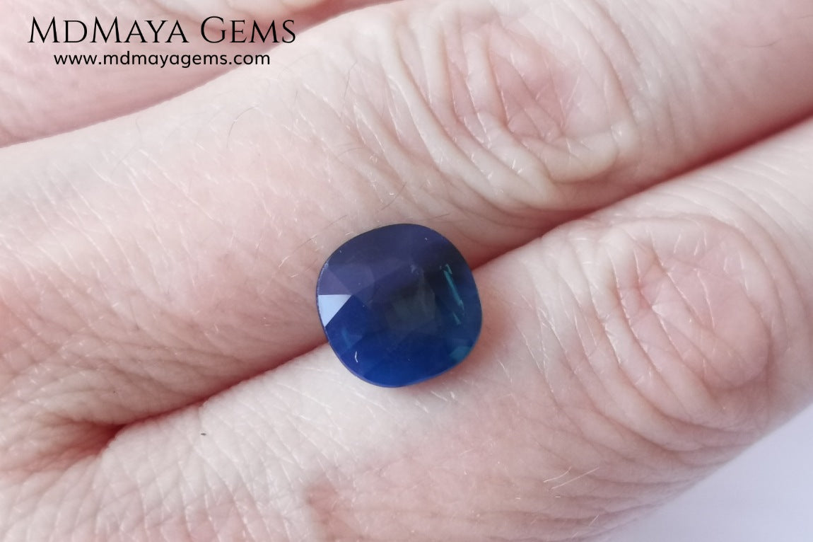 Untreated greenish blue Sapphire 3.61 ct. Cushion cut.  natural untreated blue sapphire has a large green component inside, under natural light you can see a dull and translucent blue sapphire, although under incandescent light everything changes, this sapphire shines from all sides and a bright green color is seen throughout the interior. It is a gem only for the very daring, with an extra: its price (certificate included).