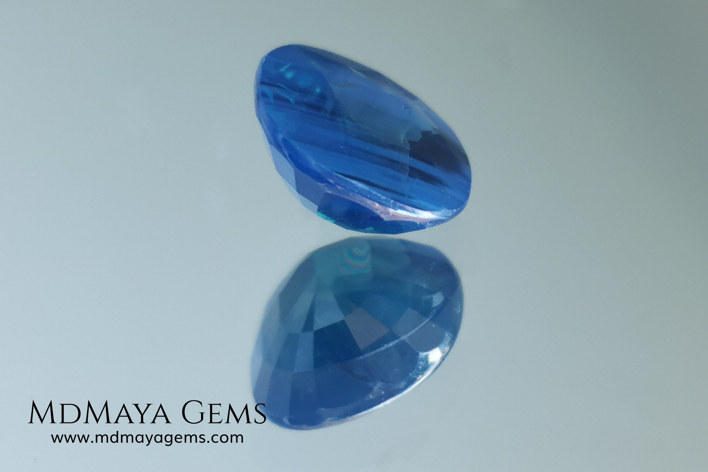 Untreated greenish blue Sapphire 3.61 ct. Cushion cut.  natural untreated blue sapphire has a large green component inside, under natural light you can see a dull and translucent blue sapphire, although under incandescent light everything changes, this sapphire shines from all sides and a bright green color is seen throughout the interior. It is a gem only for the very daring, with an extra: its price (certificate included).