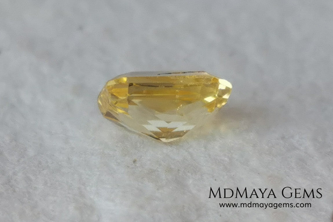  Vivid Yellow Sapphire. Radiant Cut. 0.89 ct. This small precious stone is full of life and color, its bright yellow is superb, has a nick in the crown, (this is the reason of its low price), but is an incredible gemstone that will look impressive in any ring or any piece of jewelry.