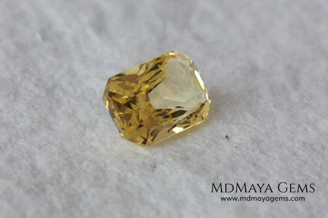  Vivid Yellow Sapphire. Radiant Cut. 0.89 ct. This small precious stone is full of life and color, its bright yellow is superb, has a nick in the crown, (this is the reason of its low price), but is an incredible gemstone that will look impressive in any ring or any piece of jewelry.