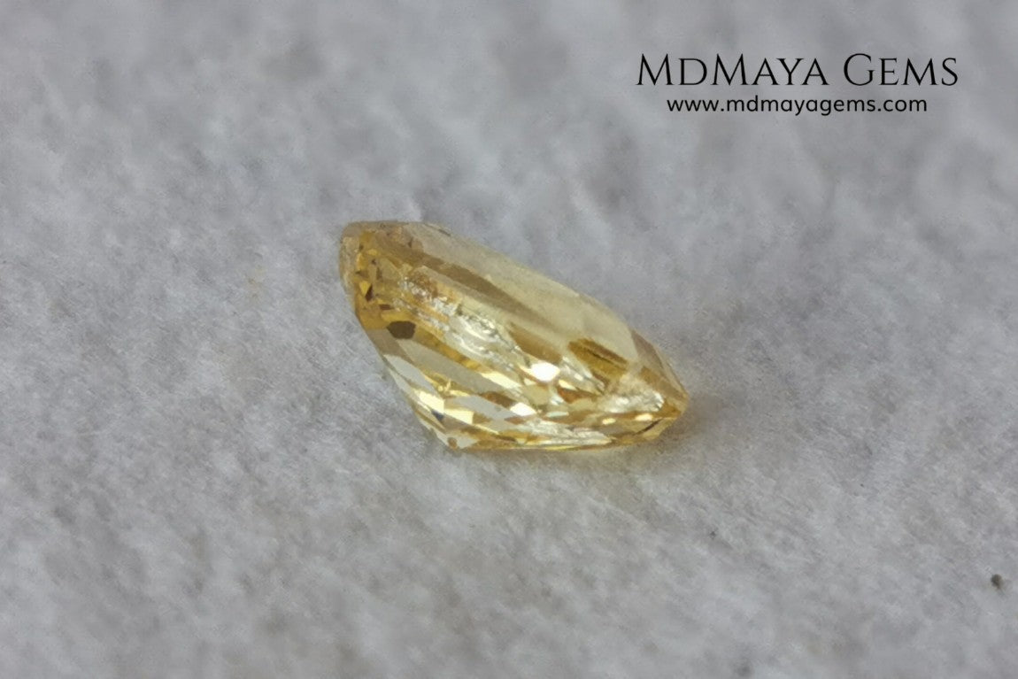  Vivid Yellow Sapphire. Radiant Cut. 0.89 ct. This small precious stone is full of life and color, its bright yellow is superb, has a nick in the crown, (this is the reason of its low price), but is an incredible gemstone that will look impressive in any ring or any piece of jewelry.