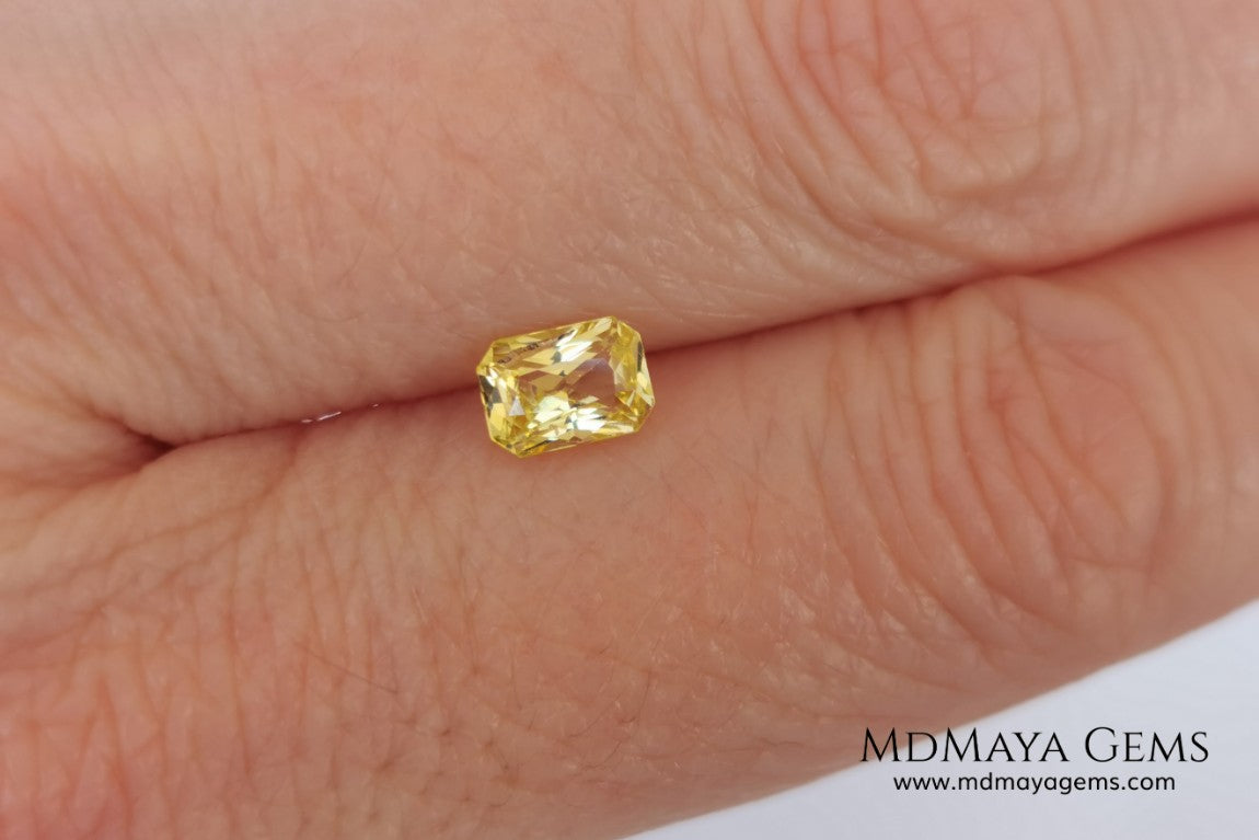  Vivid Yellow Sapphire. Radiant Cut. 0.89 ct. This small precious stone is full of life and color, its bright yellow is superb, has a nick in the crown, (this is the reason of its low price), but is an incredible gemstone that will look impressive in any ring or any piece of jewelry.