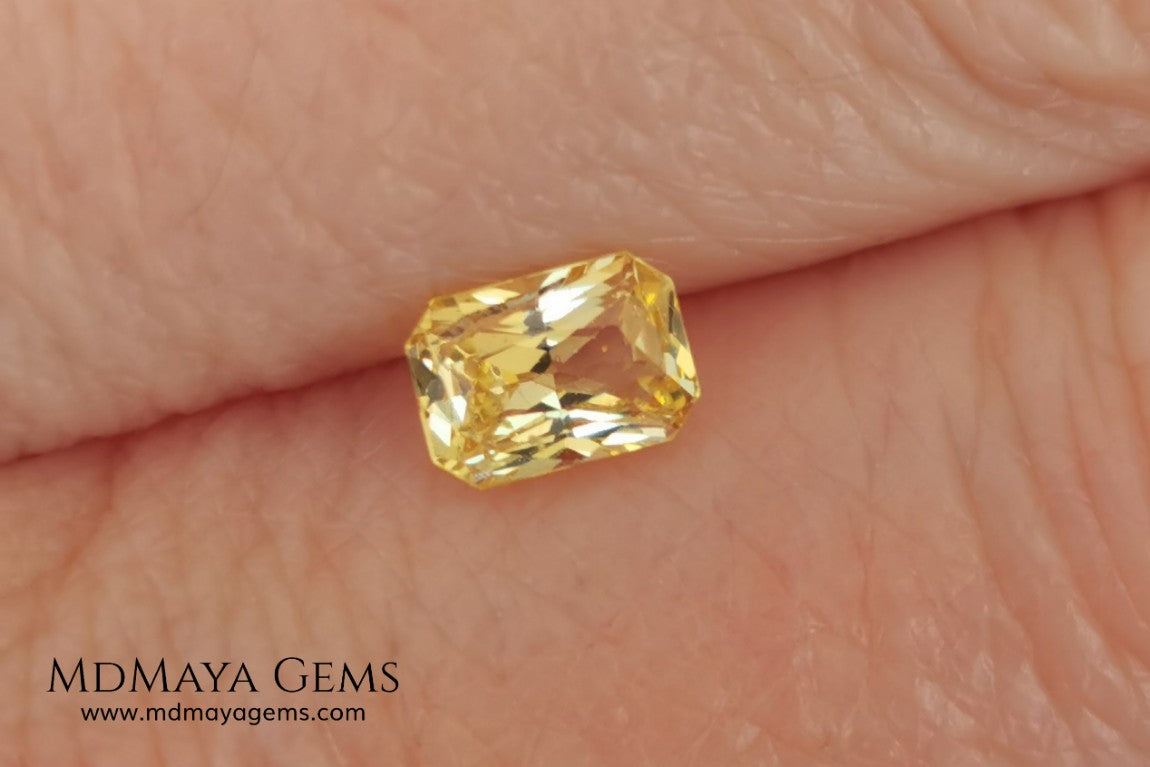  Vivid Yellow Sapphire. Radiant Cut. 0.89 ct. This small precious stone is full of life and color, its bright yellow is superb, has a nick in the crown, (this is the reason of its low price), but is an incredible gemstone that will look impressive in any ring or any piece of jewelry.