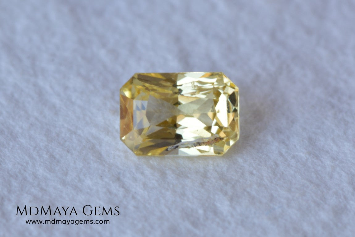  Vivid Yellow Sapphire. Radiant Cut. 0.89 ct. This small precious stone is full of life and color, its bright yellow is superb, has a nick in the crown, (this is the reason of its low price), but is an incredible gemstone that will look impressive in any ring or any piece of jewelry.