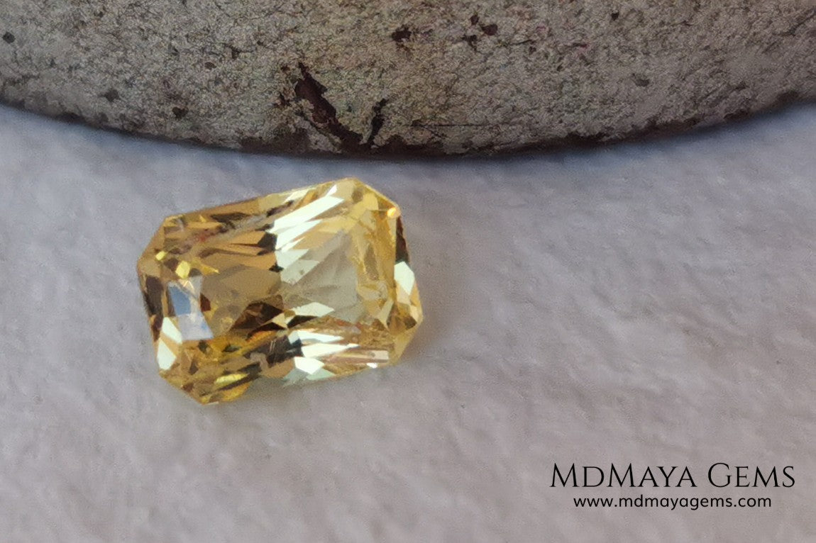  Vivid Yellow Sapphire. Radiant Cut. 0.89 ct. This small precious stone is full of life and color, its bright yellow is superb, has a nick in the crown, (this is the reason of its low price), but is an incredible gemstone that will look impressive in any ring or any piece of jewelry.