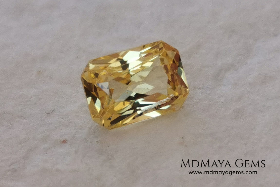  Vivid Yellow Sapphire. Radiant Cut. 0.89 ct. This small precious stone is full of life and color, its bright yellow is superb, has a nick in the crown, (this is the reason of its low price), but is an incredible gemstone that will look impressive in any ring or any piece of jewelry.