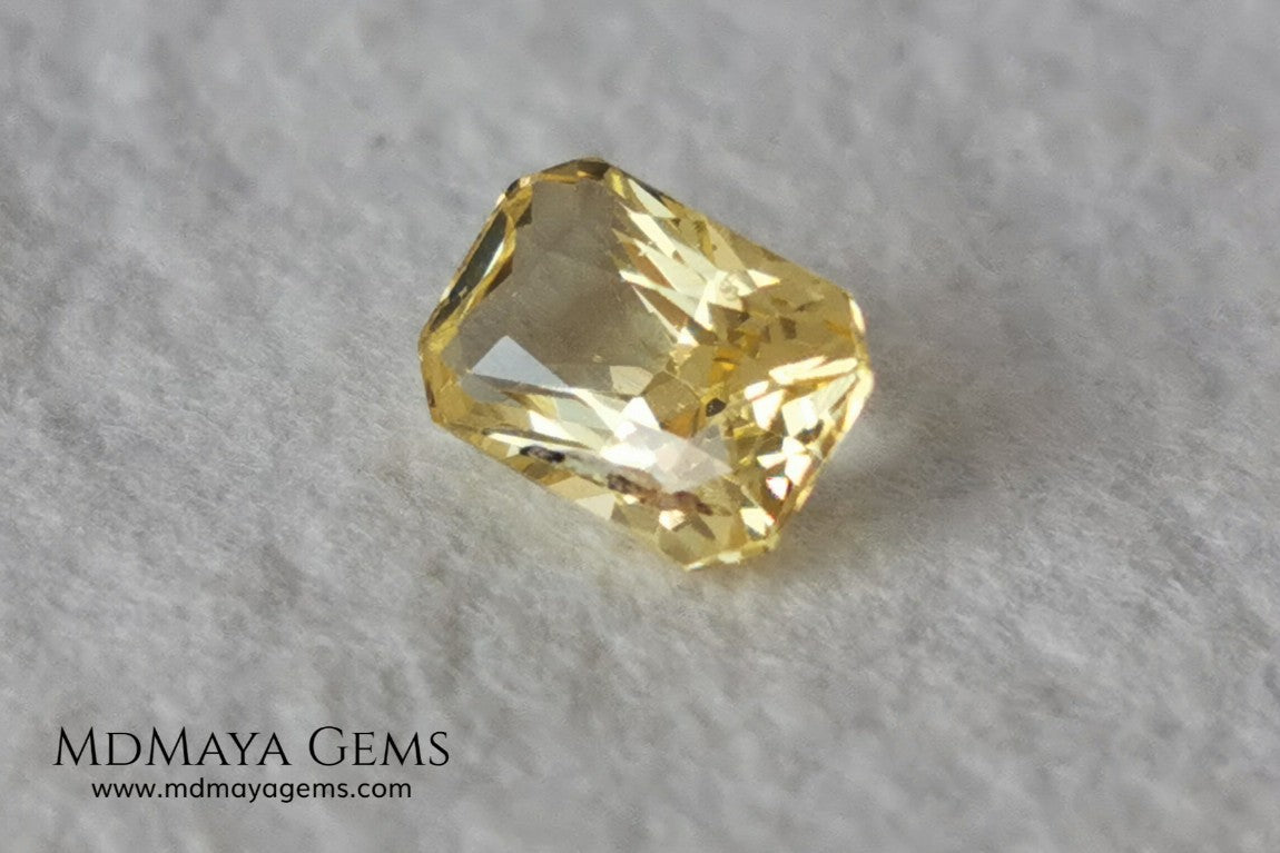  Vivid Yellow Sapphire. Radiant Cut. 0.89 ct. This small precious stone is full of life and color, its bright yellow is superb, has a nick in the crown, (this is the reason of its low price), but is an incredible gemstone that will look impressive in any ring or any piece of jewelry.